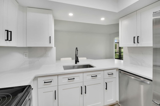7884 Seville Pl Unit 1301, Boca Raton, FL 33433 - kitchen with stainless steel dishwasher, a sink, recessed lighting, white cabinetry, and light stone counters