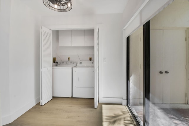 7884 Seville Pl Unit 1301, Boca Raton, FL 33433 - laundry area featuring cabinet space, independent washer and dryer, and light wood-style floors