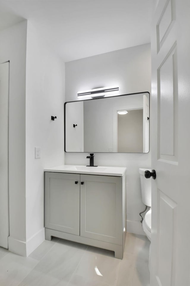 7884 Seville Pl Unit 1301, Boca Raton, FL 33433 - bathroom with baseboards, vanity, and toilet