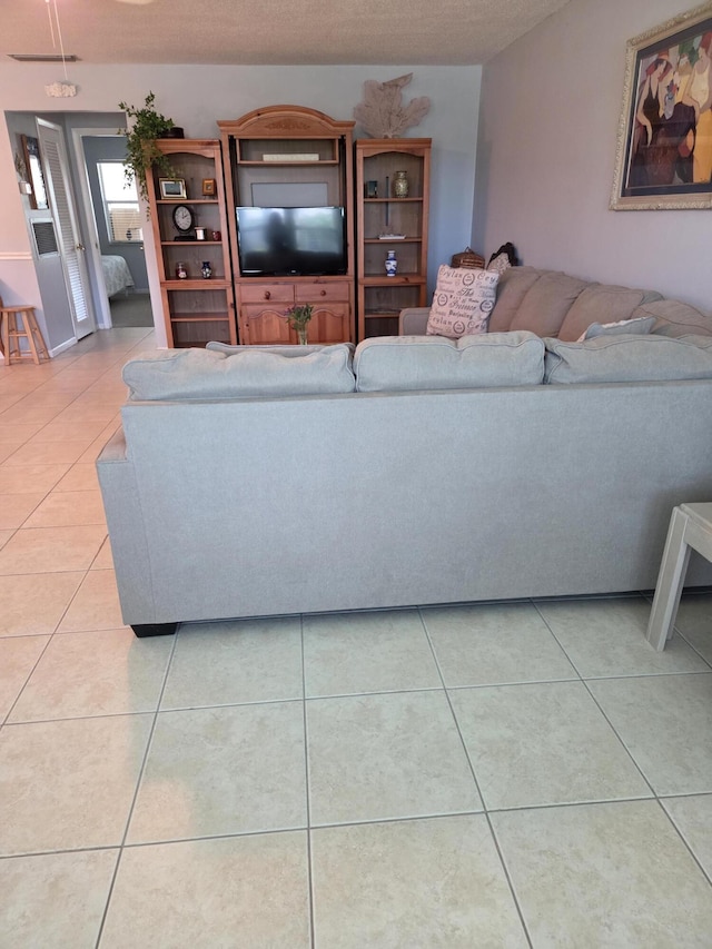 living room with light tile patterned flooring