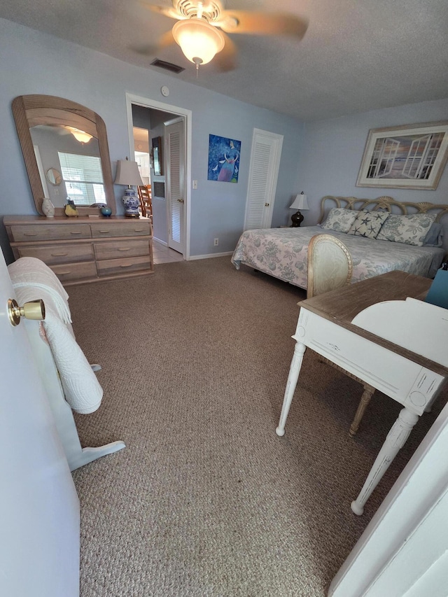 bedroom with carpet, a ceiling fan, and baseboards