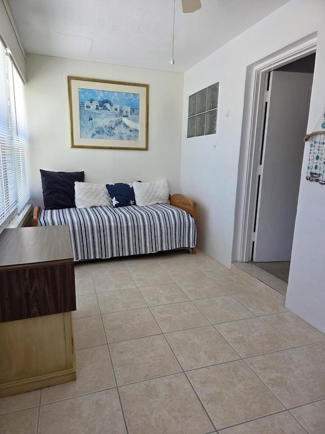 bedroom featuring light tile patterned floors and a ceiling fan