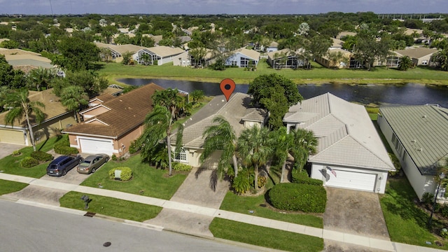 aerial view of residential area featuring a nearby body of water