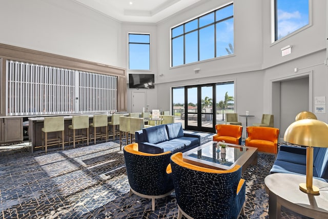 lobby with a high ceiling and crown molding