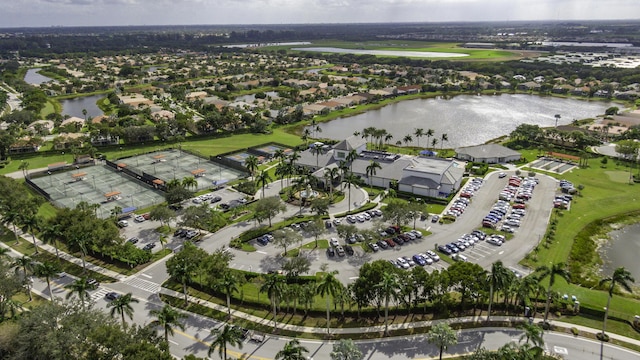view of property location with a nearby body of water and nearby suburban area