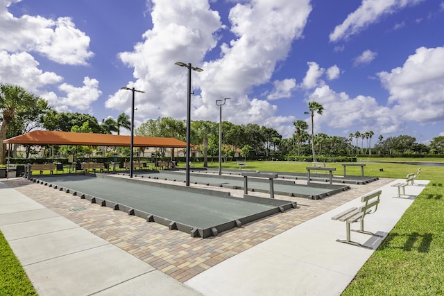 view of home's community featuring a game area and a yard