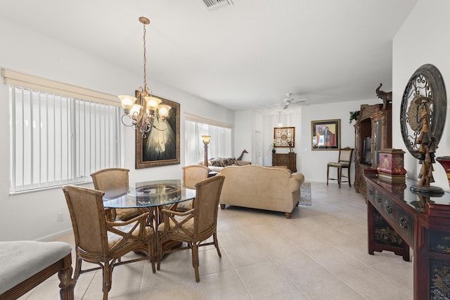 dining space with a chandelier, light tile patterned floors, and ceiling fan