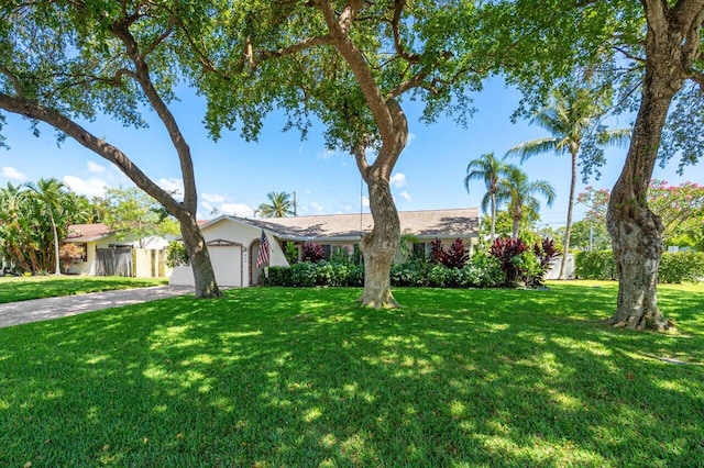 639 Mallard Dr, Delray Beach, FL 33444 - view of front of house featuring a garage and driveway