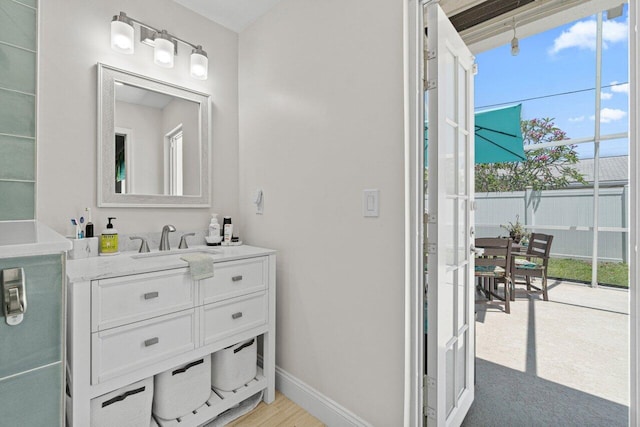 639 Mallard Dr, Delray Beach, FL 33444 - bathroom featuring vanity and baseboards