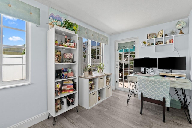 639 Mallard Dr, Delray Beach, FL 33444 - office space with wood finished floors, baseboards, and a textured ceiling