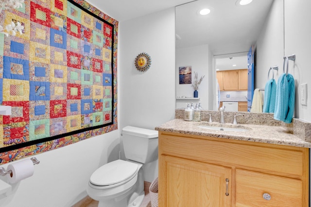 2121 N Ocean Blvd Unit 1203W, Boca Raton, FL 33431 - bathroom featuring toilet, vanity, and recessed lighting