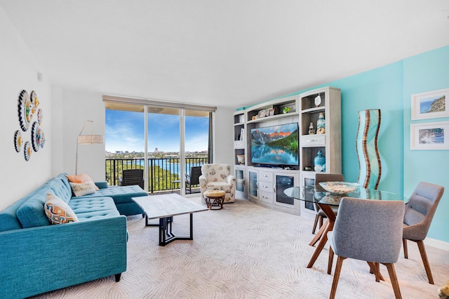 2121 N Ocean Blvd Unit 1203W, Boca Raton, FL 33431 - living area with carpet and a wall of windows