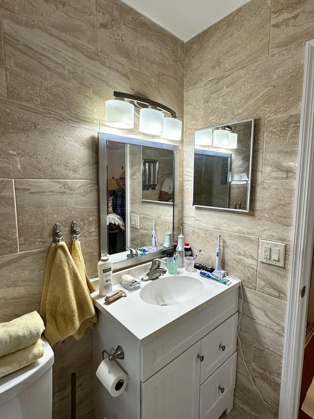 728 Ridge Rd Unit 35, Lantana, FL 33462 - bathroom featuring vanity, toilet, and tile walls