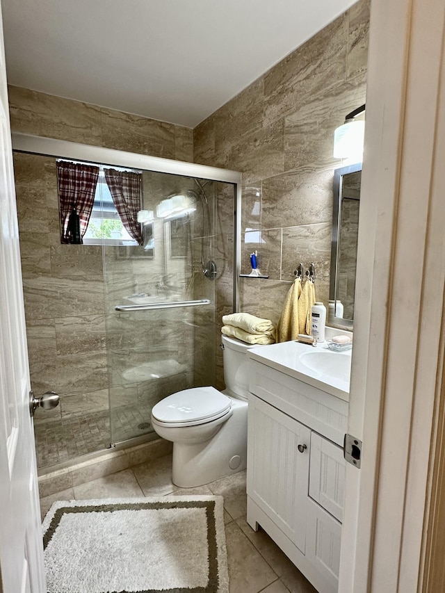 728 Ridge Rd Unit 35, Lantana, FL 33462 - full bath with toilet, a shower stall, vanity, tile patterned floors, and tile walls