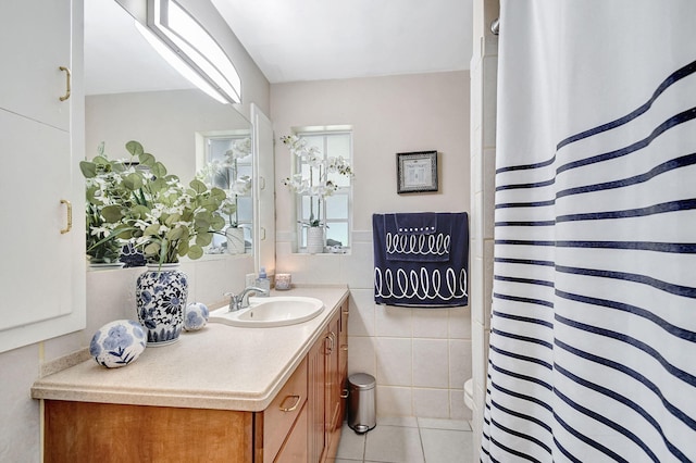 full bath featuring tile walls, vanity, tile patterned floors, and a shower with curtain