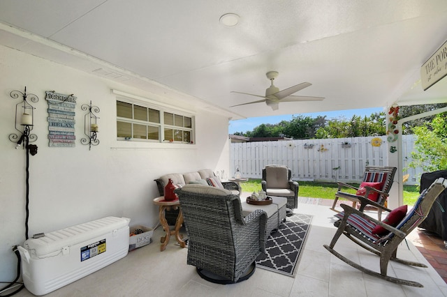 view of patio / terrace featuring a ceiling fan, fence, and an outdoor hangout area