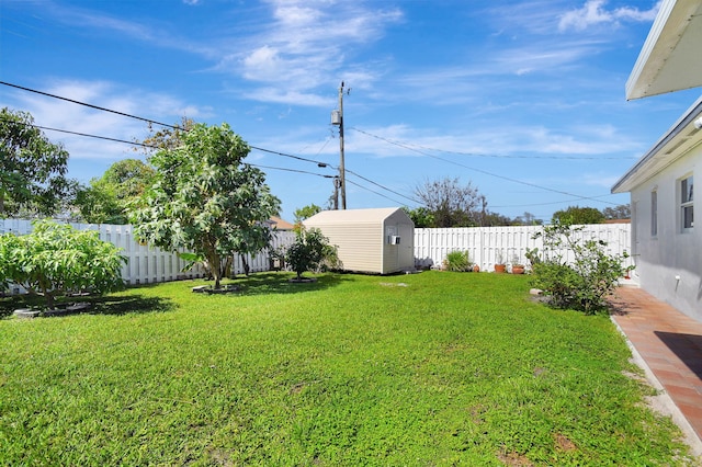 view of yard with a shed and an outbuilding