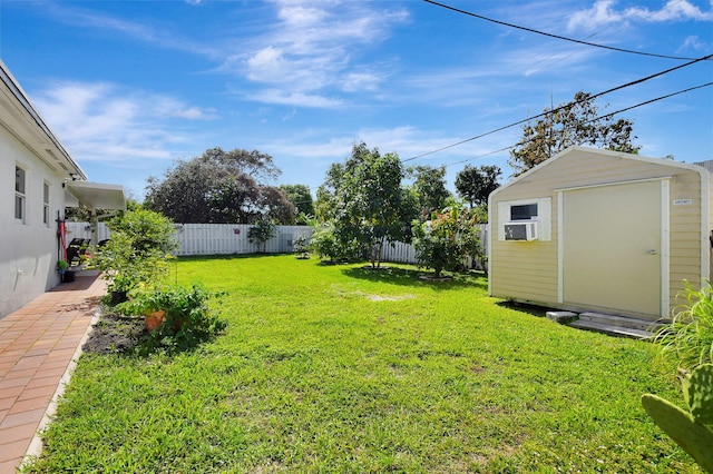 view of yard with a storage shed, an outbuilding, and cooling unit
