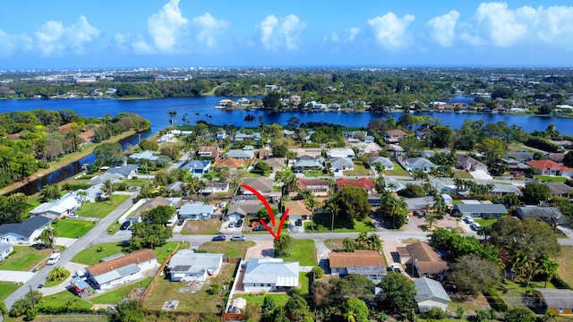 view of property location with nearby suburban area and a nearby body of water