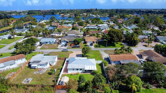 aerial view of residential area with a large body of water