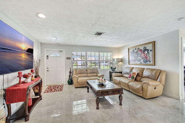 living area featuring recessed lighting