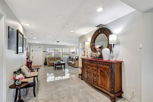hall with recessed lighting