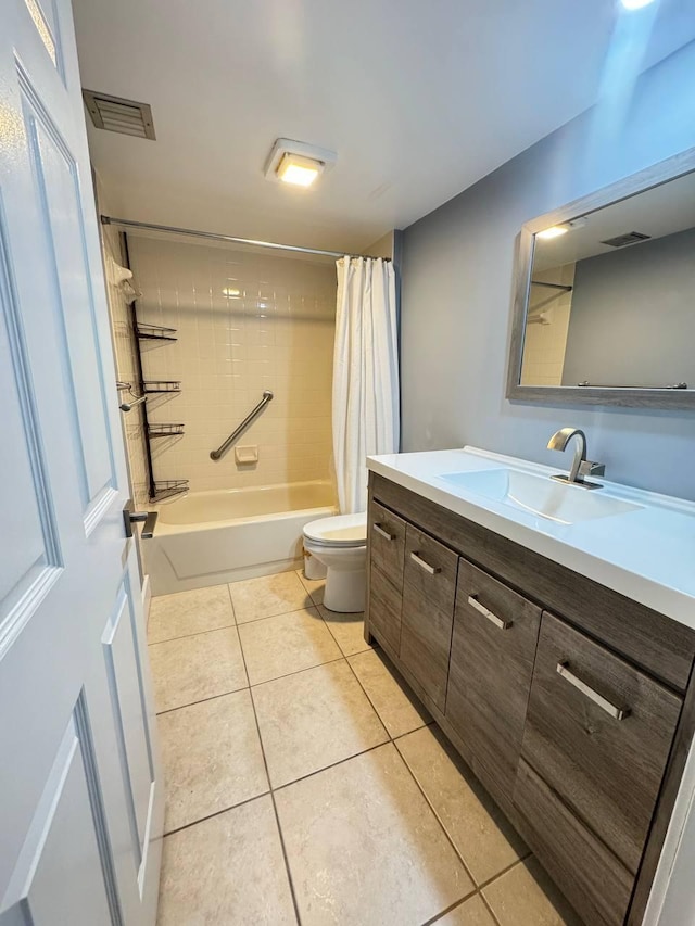 full bathroom featuring tile patterned floors, toilet, vanity, and shower / bathtub combination with curtain