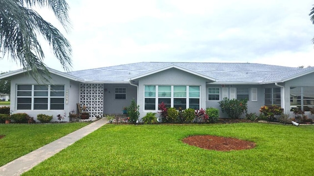14516 Canalview Dr Unit B, Delray Beach, FL 33484 - back of property featuring stucco siding and a yard