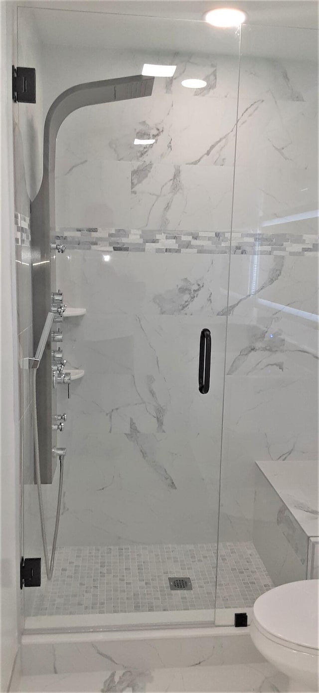 14516 Canalview Dr Unit B, Delray Beach, FL 33484 - bathroom featuring marble finish flooring and a marble finish shower