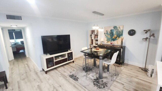 14516 Canalview Dr Unit B, Delray Beach, FL 33484 - dining space with wood finished floors and ornamental molding