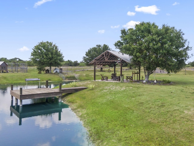 1545 Pulitzer Rd, Fort Pierce, FL 34945 - view of home's community with a gazebo, a yard, a water view, and a dock