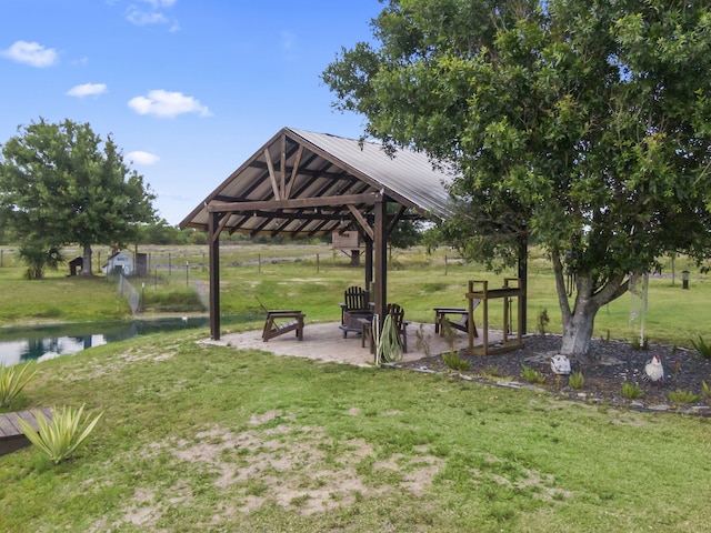 1545 Pulitzer Rd, Fort Pierce, FL 34945 - surrounding community with a gazebo, a yard, a patio, and a water view