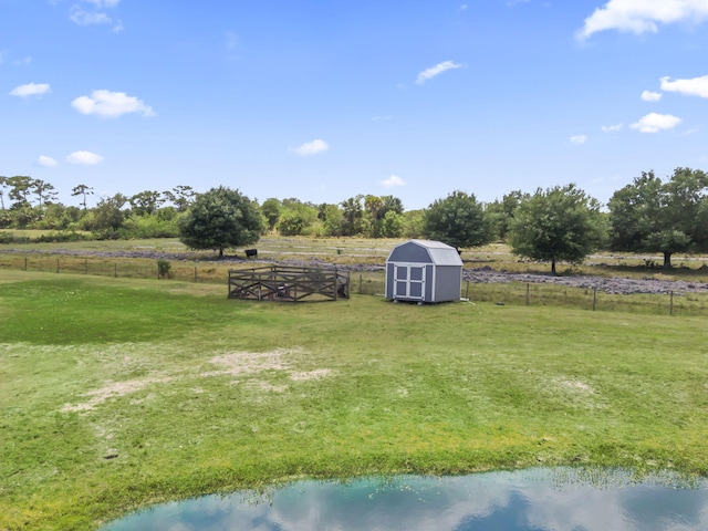 1545 Pulitzer Rd, Fort Pierce, FL 34945 - view of yard with a storage unit, a view of rural / pastoral area, and an outbuilding