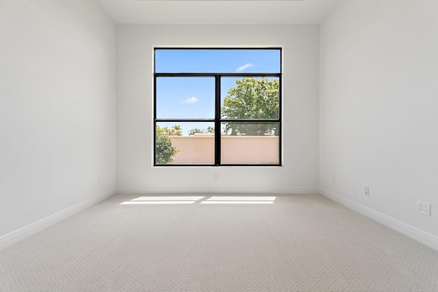 308 SE Via Sangro, Port Saint Lucie, FL 34987 - carpeted empty room featuring baseboards