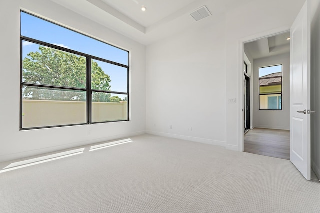 308 SE Via Sangro, Port Saint Lucie, FL 34987 - unfurnished room featuring light carpet, healthy amount of natural light, baseboards, and recessed lighting