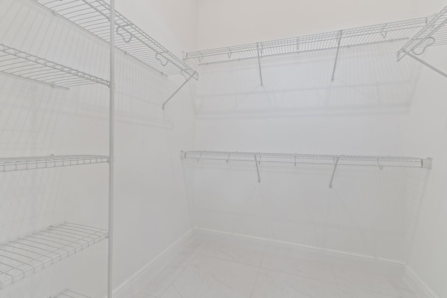 308 SE Via Sangro, Port Saint Lucie, FL 34987 - spacious closet featuring marble look tile flooring