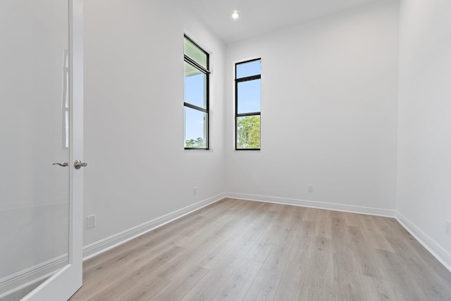 308 SE Via Sangro, Port Saint Lucie, FL 34987 - empty room featuring light wood-style flooring, baseboards, and recessed lighting