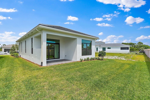 308 SE Via Sangro, Port Saint Lucie, FL 34987 - rear view of house with stucco siding and a patio