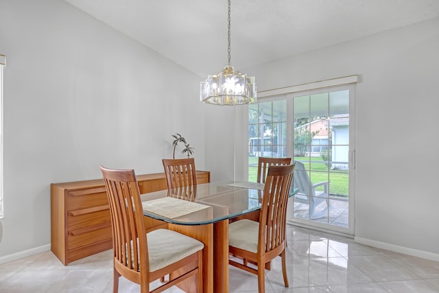 1265 Pine Sage Cir, West Palm Beach, FL 33409 - dining room with a chandelier, lofted ceiling, and light tile patterned floors