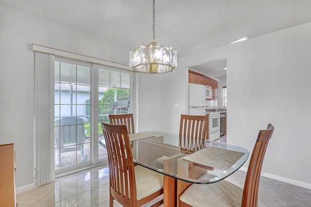 1265 Pine Sage Cir, West Palm Beach, FL 33409 - dining room featuring a chandelier and light tile patterned flooring