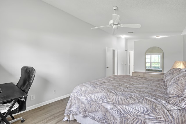 1265 Pine Sage Cir, West Palm Beach, FL 33409 - bedroom featuring wood finished floors, a ceiling fan, and an office area