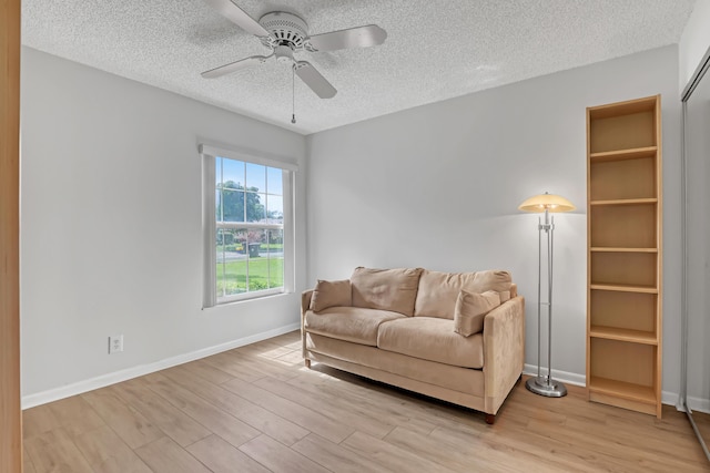 1265 Pine Sage Cir, West Palm Beach, FL 33409 - sitting room featuring a textured ceiling, wood finished floors, and ceiling fan