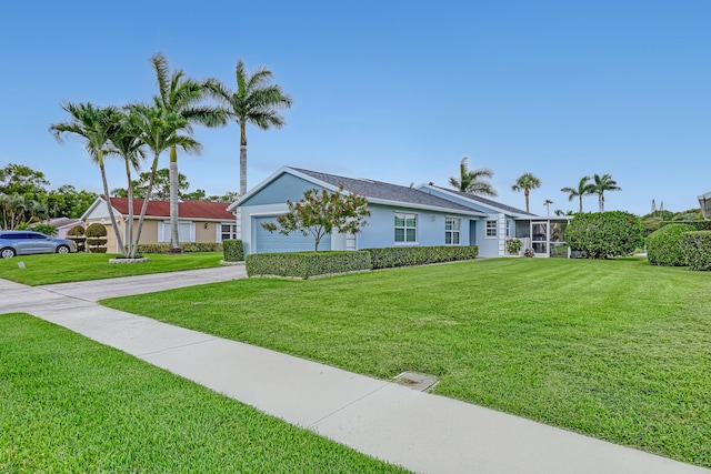 1265 Pine Sage Cir, West Palm Beach, FL 33409 - ranch-style house featuring driveway, an attached garage, a front yard, and stucco siding
