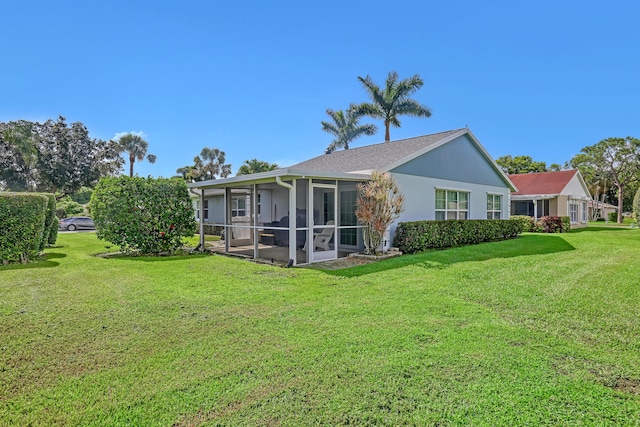 1265 Pine Sage Cir, West Palm Beach, FL 33409 - back of house featuring a sunroom and a yard