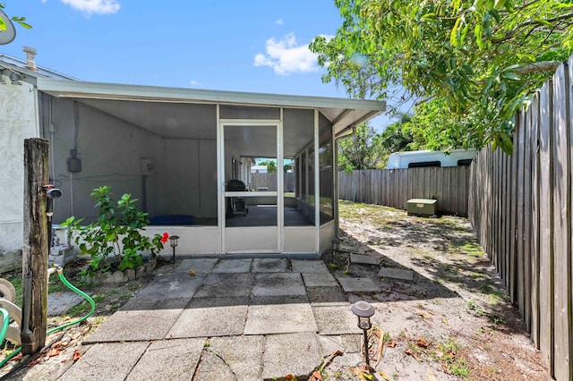 4755 Centurian Way, Greenacres, FL 33463 - view of patio / terrace featuring a sunroom and a fenced backyard