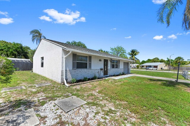 4755 Centurian Way, Greenacres, FL 33463 - ranch-style home featuring an attached garage, brick siding, and stucco siding