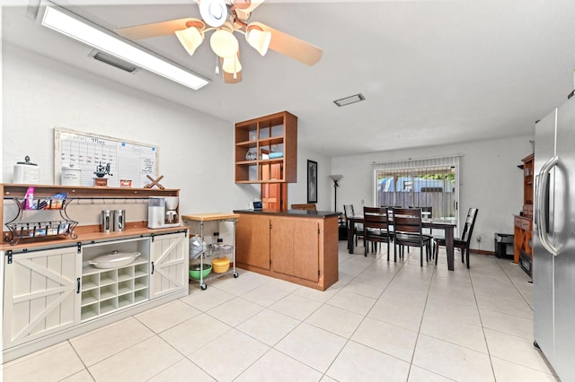4755 Centurian Way, Greenacres, FL 33463 - kitchen with ceiling fan, freestanding refrigerator, and light tile patterned floors