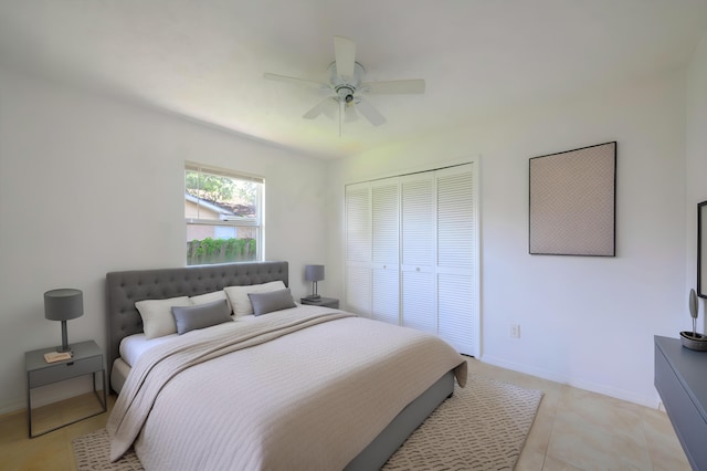 554 NW Twylite Ter, Port Saint Lucie, FL 34953 - bedroom featuring a closet, baseboards, a ceiling fan, and light tile patterned floors