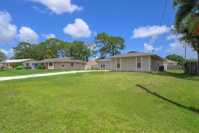 554 NW Twylite Ter, Port Saint Lucie, FL 34953 - view of front facade featuring cooling unit and stucco siding