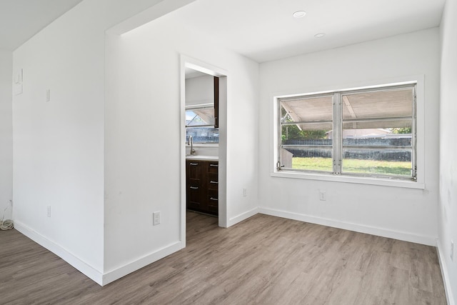 604 W Ocean Ave, Lantana, FL 33462 - unfurnished bedroom featuring wood finished floors and baseboards